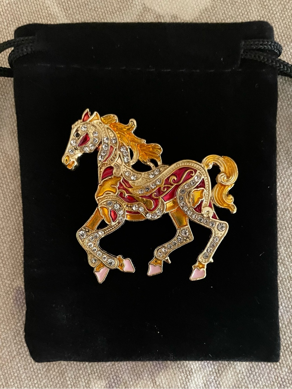 Gold-Tone Horse Brooch with Red and orange  Enamel Accents